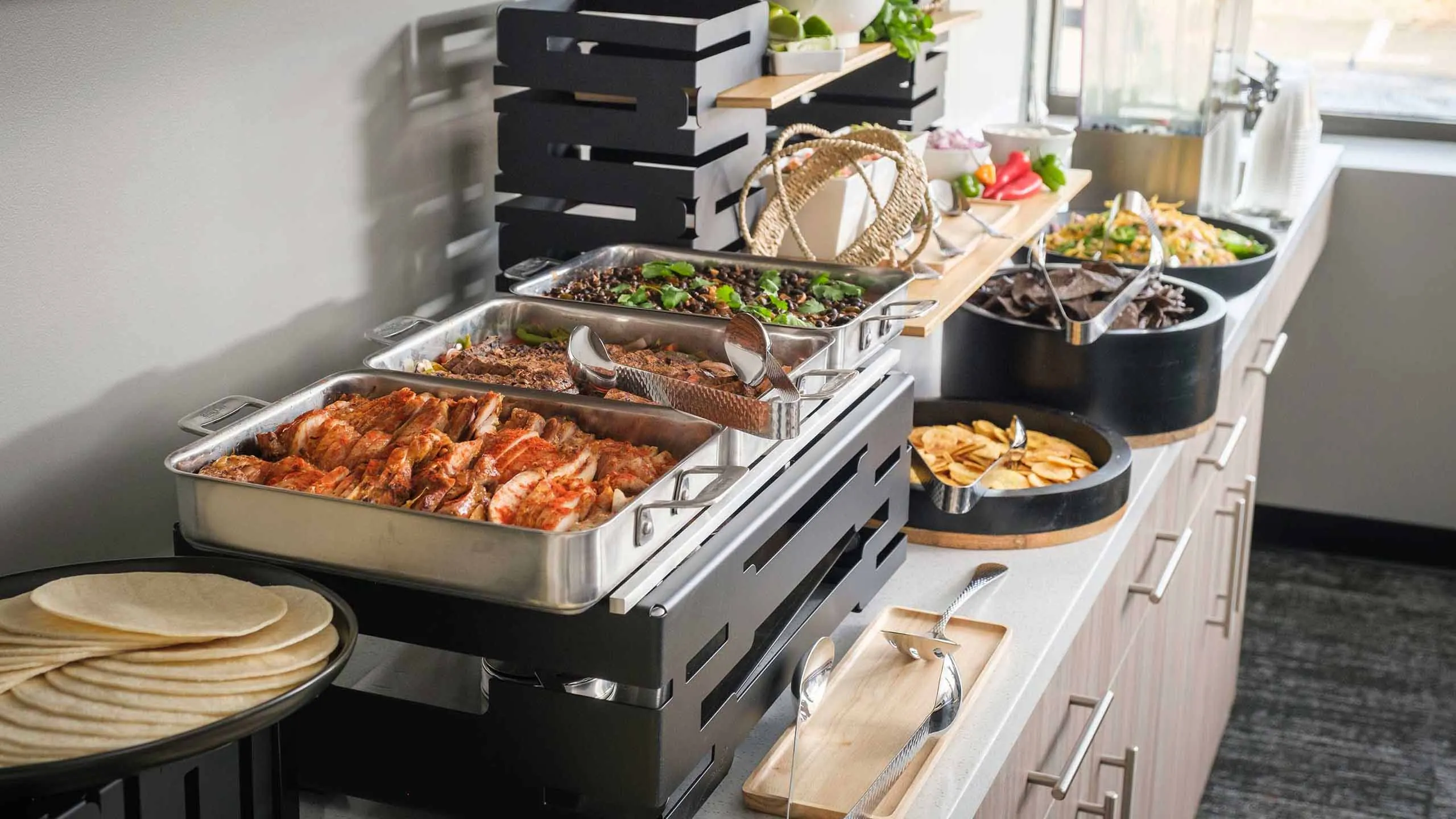A catered buffet table with various dishes