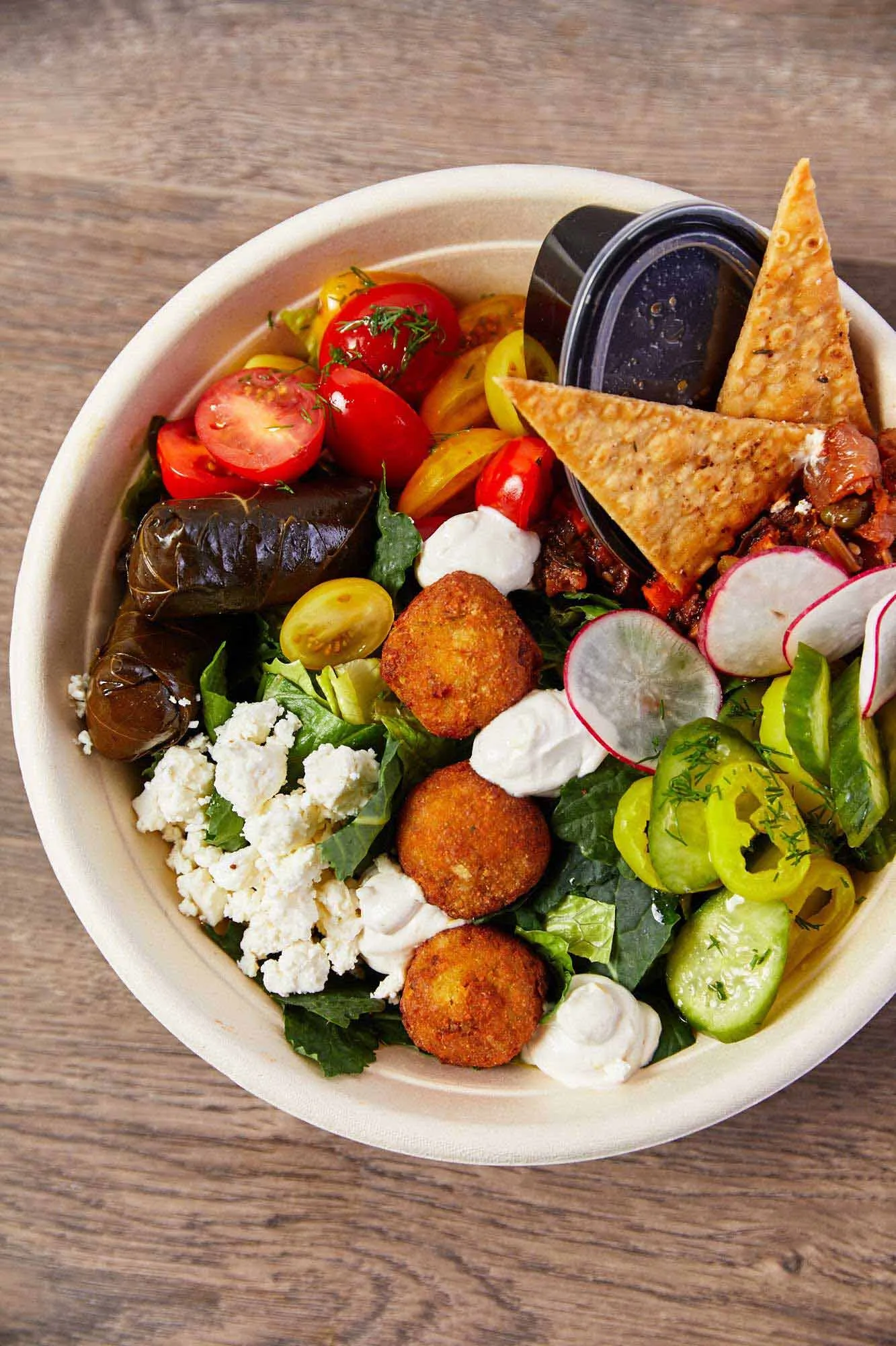 Overhead shot of Asian grilled steak and vegetable bowl with lime, broccoli, edamame and cabbage